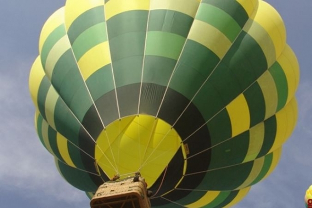  low angle view of a green and yellow balloon 